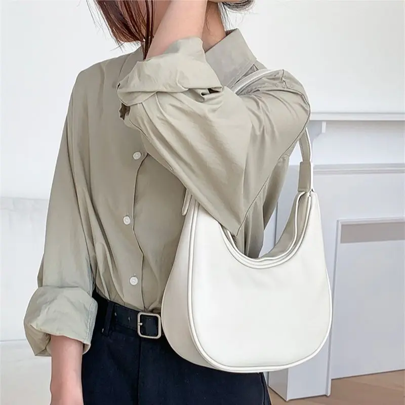 Niche retro female bag solid color underarm bag popular new simple fashion shoulder bag senior sense leisure handbag
Niche retro female bag solid color underarm bag popular new simple fashion shoulder bag senior sense leisure handbag