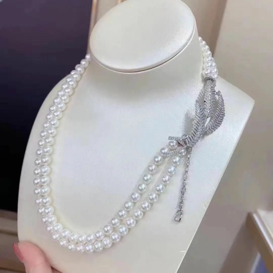 Ожерелье из двух нитей с белым жемчугом диаметром 8-9 мм
Ожерелье из двух нитей с белым жемчугом диаметром 8-9 мм