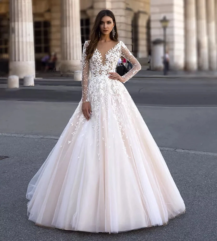 Charming A Line Wedding Dresses Romantic Appliued Sheer Neck Tulle Bridal Gown Sexy See Thru Back Long Sleeves Robe de Mariee
Charming A Line Wedding Dresses Romantic Appliued Sheer Neck Tulle Bridal Gown Sexy See Thru Back Long Sleeves Robe de Mariee