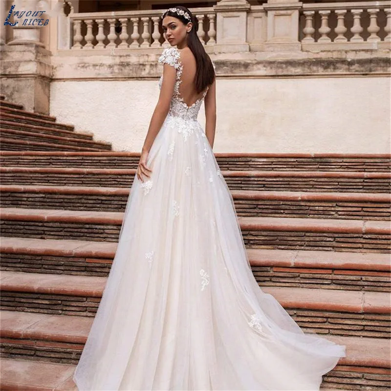 Elegant V-Neck Cap Sleeve Wedding Dress Backless Lace Bridal Gown Appliques Zipper Tulle Train vestido noiva boho Vintage Bride
Elegant V-Neck Cap Sleeve Wedding Dress Backless Lace Bridal Gown Appliques Zipper Tulle Train vestido noiva boho Vintage Bride