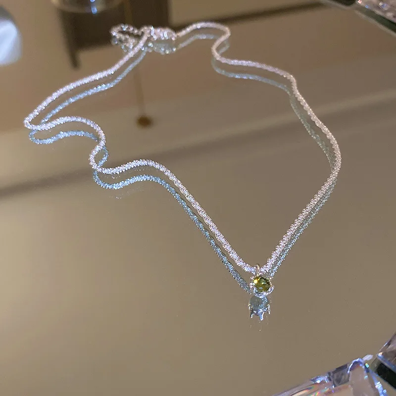 Минимализм Chocker Сверкающее циркониевое Decor Серебряная цепочка и Элегантное ожерелье с зелеными бриллиантами Стразы
Минимализм Chocker Сверкающее циркониевое Decor Серебряная цепочка и Элегантное ожерелье с зелеными бриллиантами Стразы