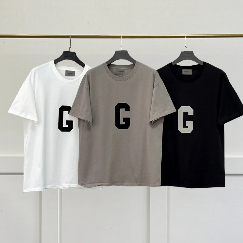 Oversized Essentials T-Shirt G flocking Letter Loose High Quality t-Shirts Summer Men Women Hip-Hop Cotton Short Sleeve
Oversized Essentials T-Shirt G flocking Letter Loose High Quality t-Shirts Summer Men Women Hip-Hop Cotton Short Sleeve