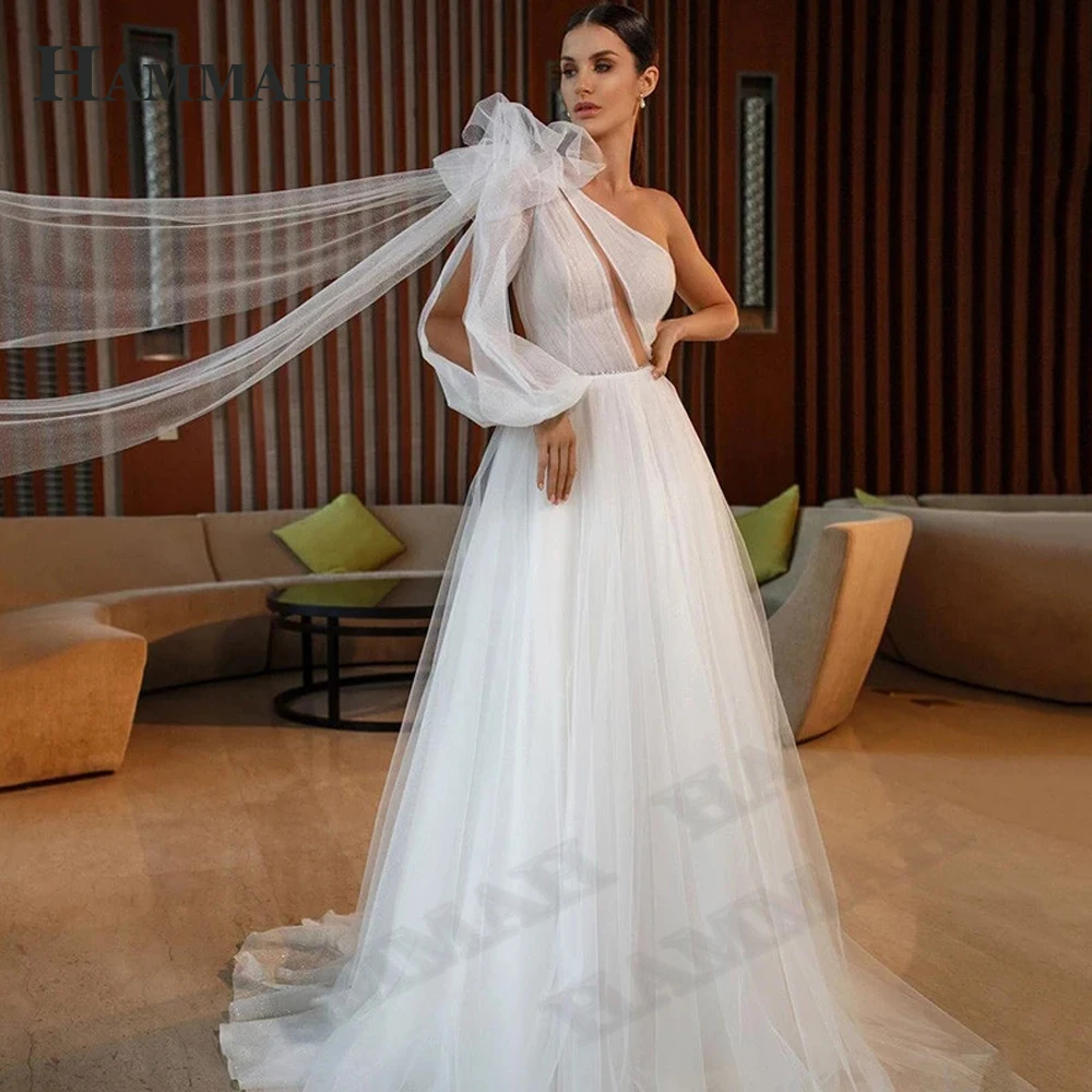 HAMMAH Sexy Beach Wedding Dresses For Bride Appliques Sparkly Tulle One Shoulder Boho Long Sleeve Vestidos De Novia Court Train
HAMMAH Sexy Beach Wedding Dresses For Bride Appliques Sparkly Tulle One Shoulder Boho Long Sleeve Vestidos De Novia Court Train
