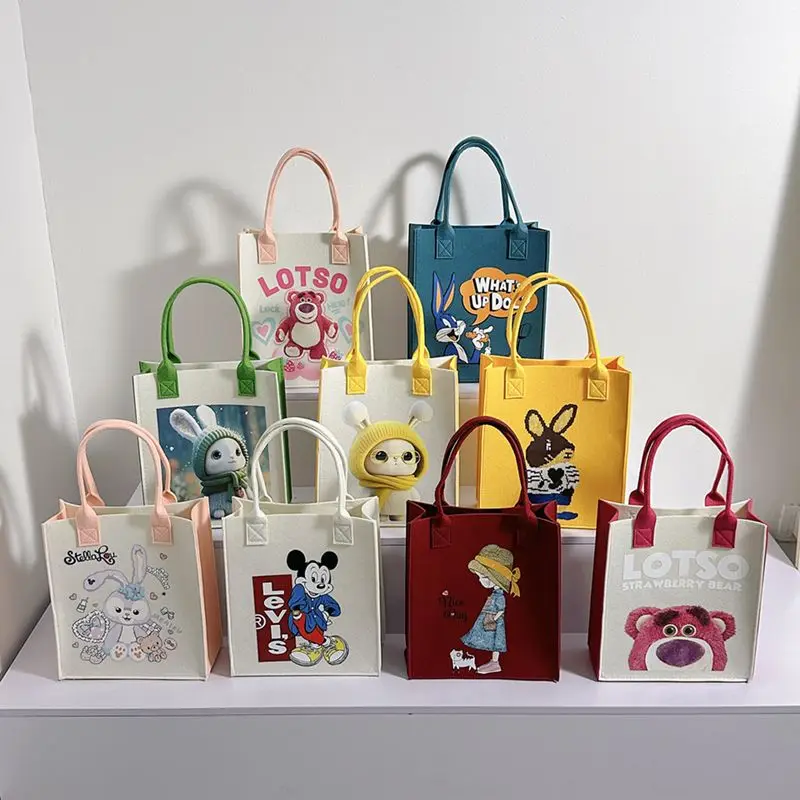 New felt bag handbag cartoon birthday Hundred Days banquet gift hand gift shopping bag doll girl small carrying bag
New felt bag handbag cartoon birthday Hundred Days banquet gift hand gift shopping bag doll girl small carrying bag