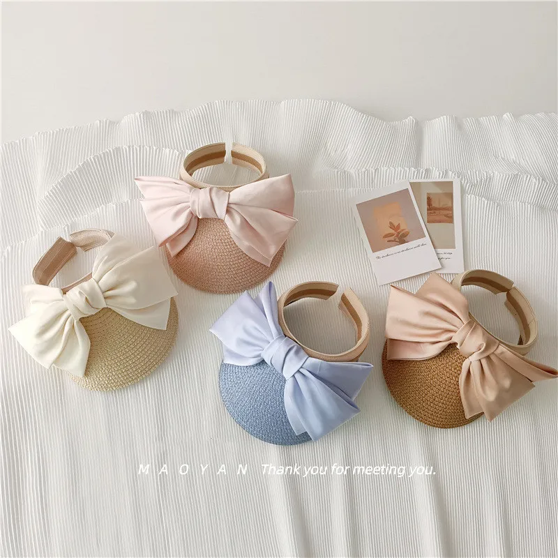 Mother Kids Straw Hat Solid Color Chic Style Ribbon Big Bow Peak Cap Summer Empty Top Hat Sunshade Beach Hat for Children Girl 
Mother Kids Straw Hat Solid Color Chic Style Ribbon Big Bow Peak Cap Summer Empty Top Hat Sunshade Beach Hat for Children Girl