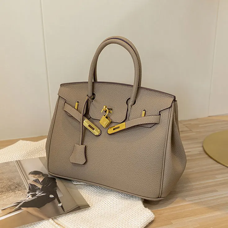 Birkin Leather Women Bag Large Capacity Handbag One Shoulder Cross Mother Bag 2023 New Wedding Bag
Birkin Leather Women Bag Large Capacity Handbag One Shoulder Cross Mother Bag 2023 New Wedding Bag
