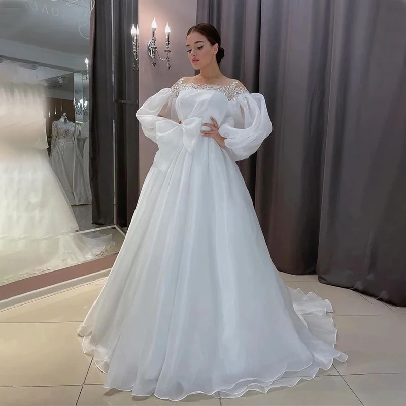 Fashion Boat Neck Bow Wedding Dresses Puff Long Sleeves Appliques Lace Lace-Up Back Princess Bridal Mariage Gowns
Fashion Boat Neck Bow Wedding Dresses Puff Long Sleeves Appliques Lace Lace-Up Back Princess Bridal Mariage Gowns