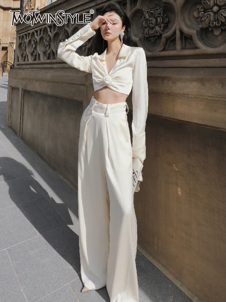 TWOTWINSTYLE Elegant White Two Piece Set Womens V Neck Long Sleeve Tops High Waist Loose Wide Leg Pants Solid Sets Female Spring
TWOTWINSTYLE Elegant White Two Piece Set Womens V Neck Long Sleeve Tops High Waist Loose Wide Leg Pants Solid Sets Female Spring