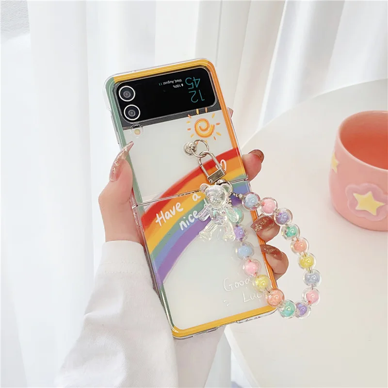 Fresh Rainbow Bear Beads Pendant Phone Case for Samsung Galaxy Z Flip 3 Z Flip 4 Hard PC Back Cover for ZFlip3 ZFlip4 Case Shell
Fresh Rainbow Bear Beads Pendant Phone Case for Samsung Galaxy Z Flip 3 Z Flip 4 Hard PC Back Cover for ZFlip3 ZFlip4 Case Shell