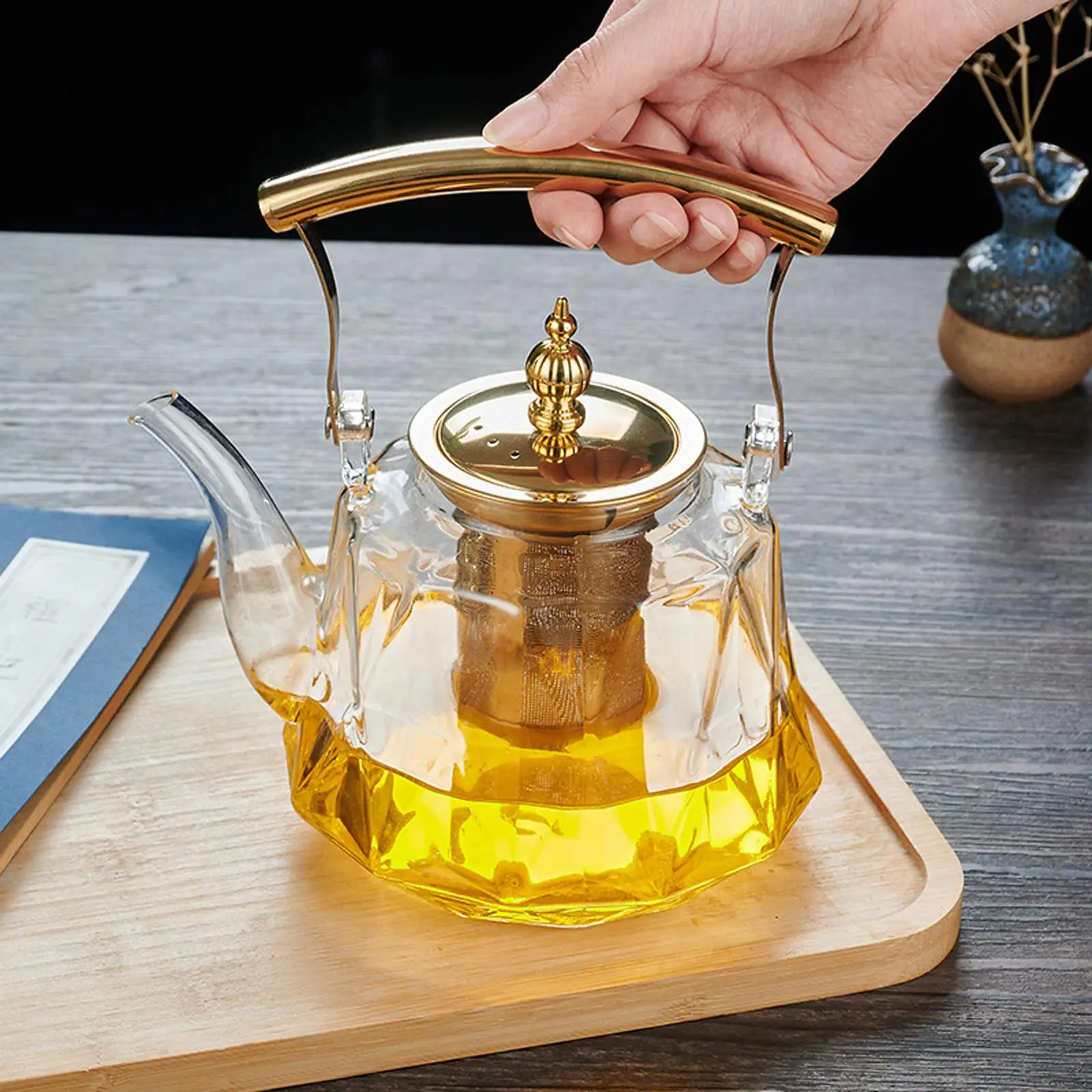 Glass Teapot Copper Handle 33 oz Removable Infuser Large Capacity Blooming Tea 
Glass Teapot Copper Handle 33 oz Removable Infuser Large Capacity Blooming Tea