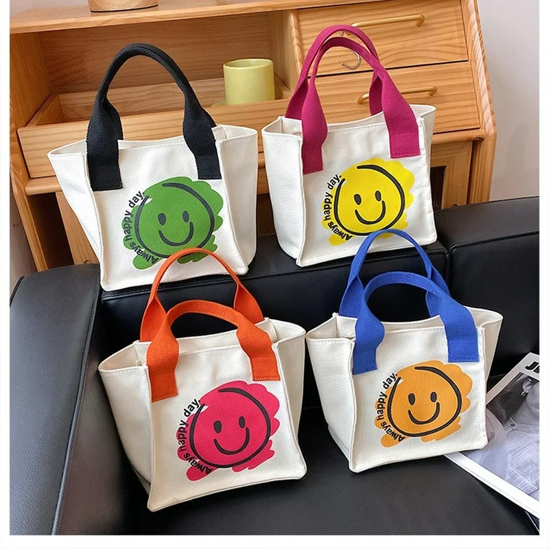 Sugevabo Canvas Handbag Cartoon Smiley Multifunctional Office Worker Mini Bento Bag Women Trend Snacks Fruit Crossbody Bag
Sugevabo Canvas Handbag Cartoon Smiley Multifunctional Office Worker Mini Bento Bag Women Trend Snacks Fruit Crossbody Bag