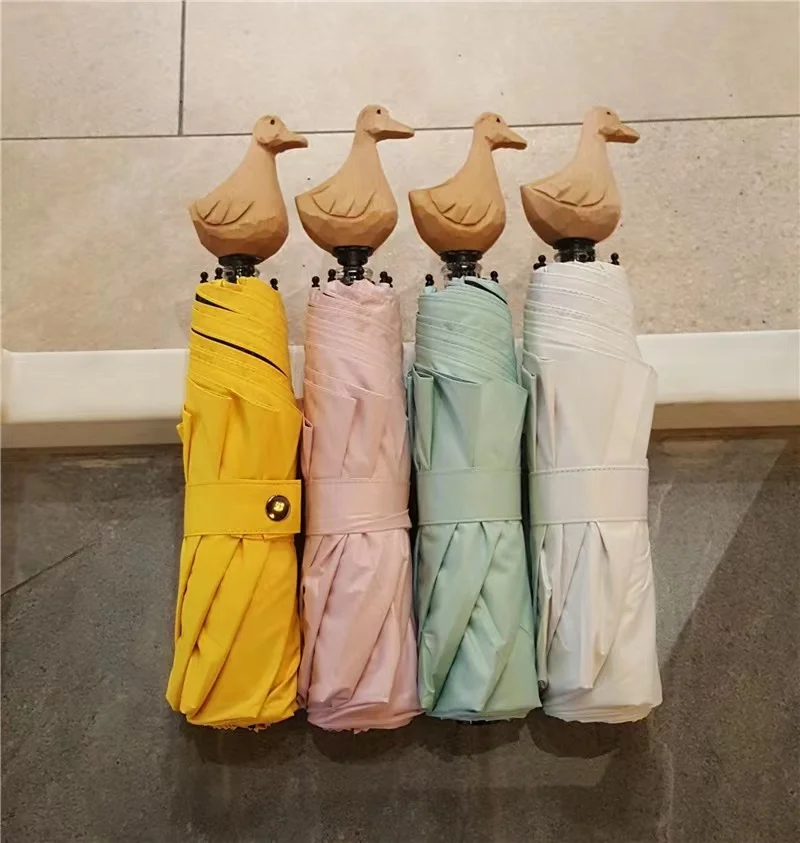 Creative tide products handmade wood carving small yellow duck vinyl folding sunscreen sunny umbrella cute cartoon men's and wom 
Creative tide products handmade wood carving small yellow duck vinyl folding sunscreen sunny umbrella cute cartoon men's and wom