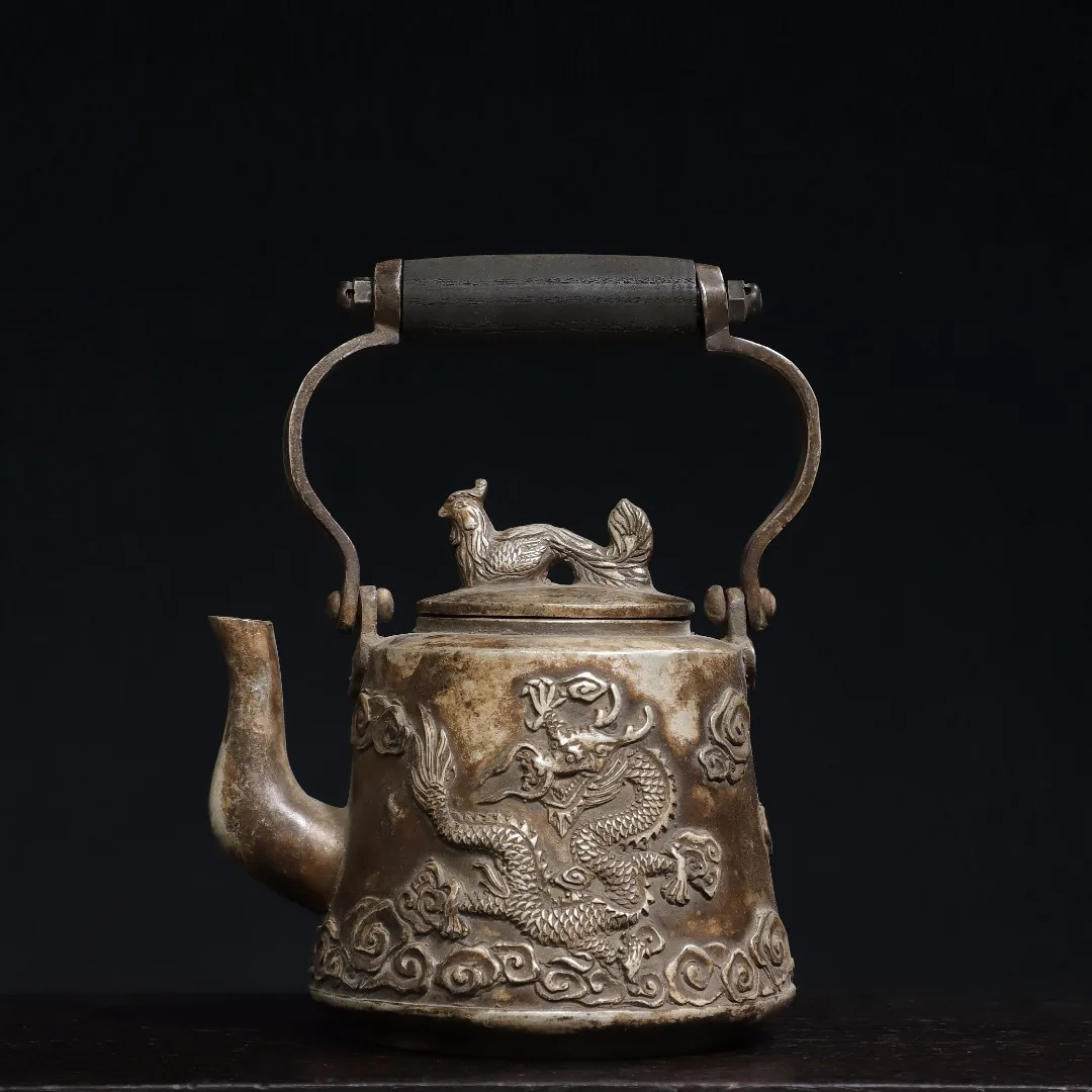 8"Tibet Temple Collection Old Bronze Gilding Silver Dragon Phoenix Pattern kettle Teapot flagon Ornaments Town house 
8"Tibet Temple Collection Old Bronze Gilding Silver Dragon Phoenix Pattern kettle Teapot flagon Ornaments Town house