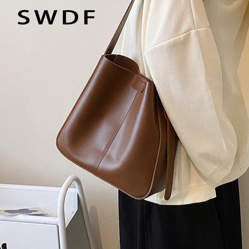 SWDF Tangan Bucket Desainer Wanita Kulit PU Kecil Trendi Musim Panas 2023 Tas Selempang Bahu Wanita Mode Merek Mewah Sac Handbag
SWDF Tangan Bucket Desainer Wanita Kulit PU Kecil Trendi Musim Panas 2023 Tas Selempang Bahu Wanita Mode Merek Mewah Sac Handbag