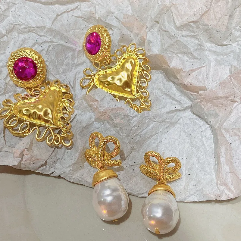 Statement Fashion Metallic Golden Heart Knot Pearl Earrings For Women Personality New Pendientes 2022
Statement Fashion Metallic Golden Heart Knot Pearl Earrings For Women Personality New Pendientes 2022