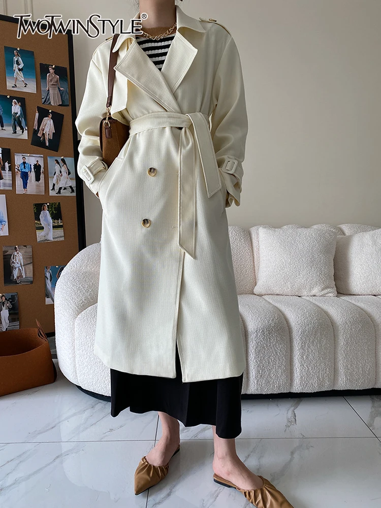 TWOTWINSTYLE Streetwear Coats Female Lapel Long Sleeve Patchwork Belted Loose Casual Windbreaker For Women 2022 Autumn Style New
TWOTWINSTYLE Streetwear Coats Female Lapel Long Sleeve Patchwork Belted Loose Casual Windbreaker For Women 2022 Autumn Style New