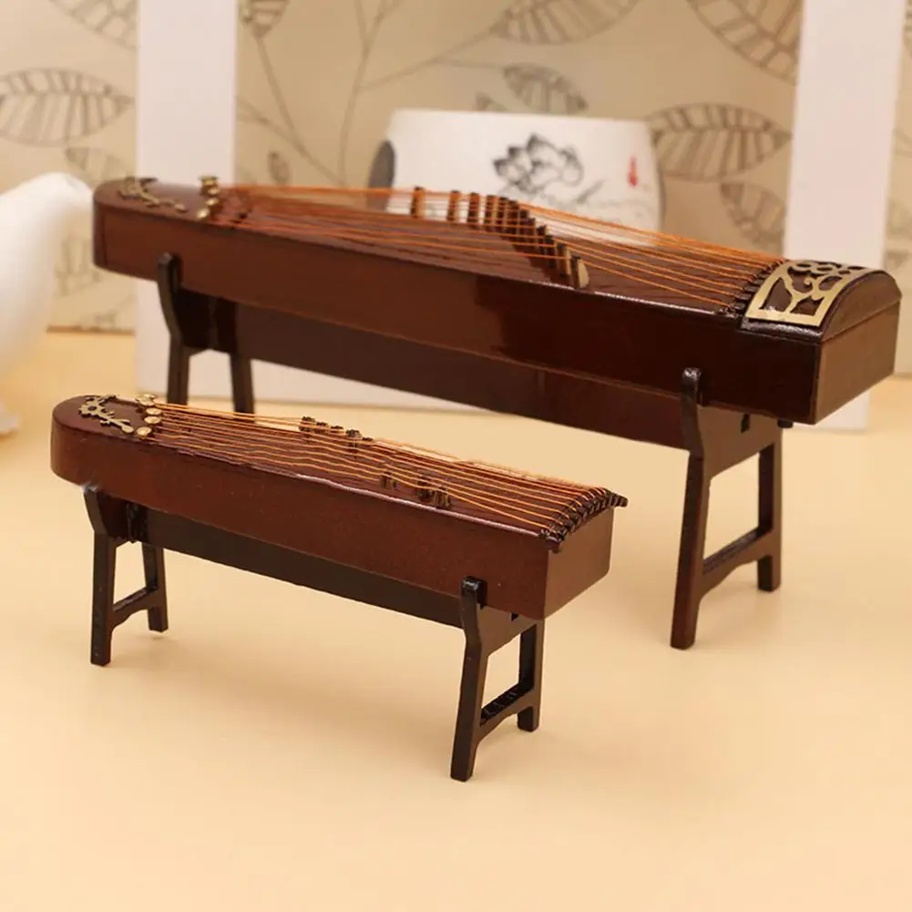 Mini Guzheng Ornament Wooden Guzheng Musical Instrument Model Dollhouse Scene Decoration Accessories
Mini Guzheng Ornament Wooden Guzheng Musical Instrument Model Dollhouse Scene Decoration Accessories