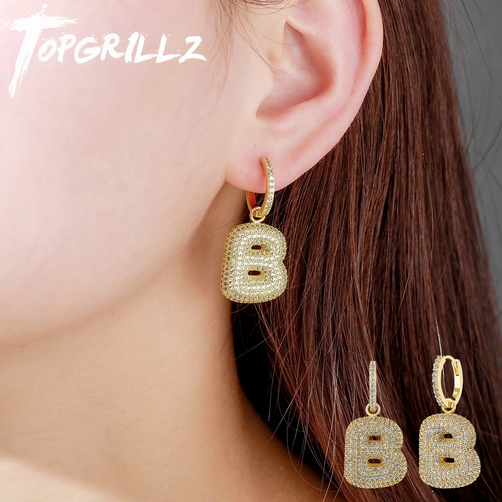 TOPGRILLZ Новые висячие серьги с буквенным принтом в виде пузырьков, серьги из кубического циркония со льдом, высококачественные Медные модные ювелирные изделия в стиле хип-хоп
TOPGRILLZ Новые висячие серьги с буквенным принтом в виде пузырьков, серьги из кубического циркония со льдом, высококачественные Медные модные ювелирные изделия в стиле хип-хоп