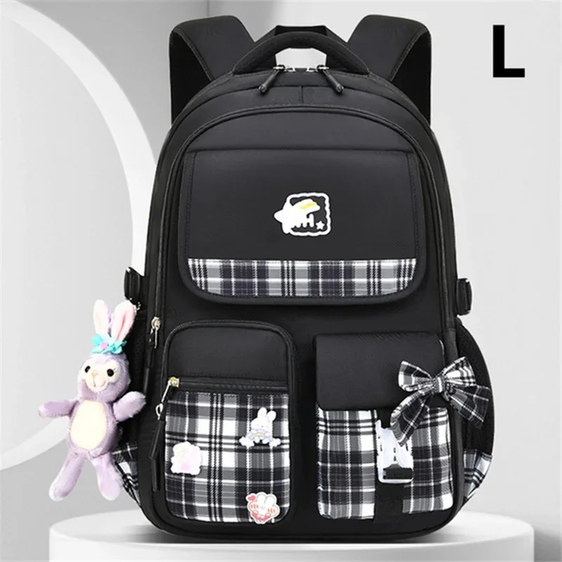 

2023 New Bowknot schoolbag for teenage girls High capacity orthopedic backpack With cartoon pendant School Bags 2 Size Satchel