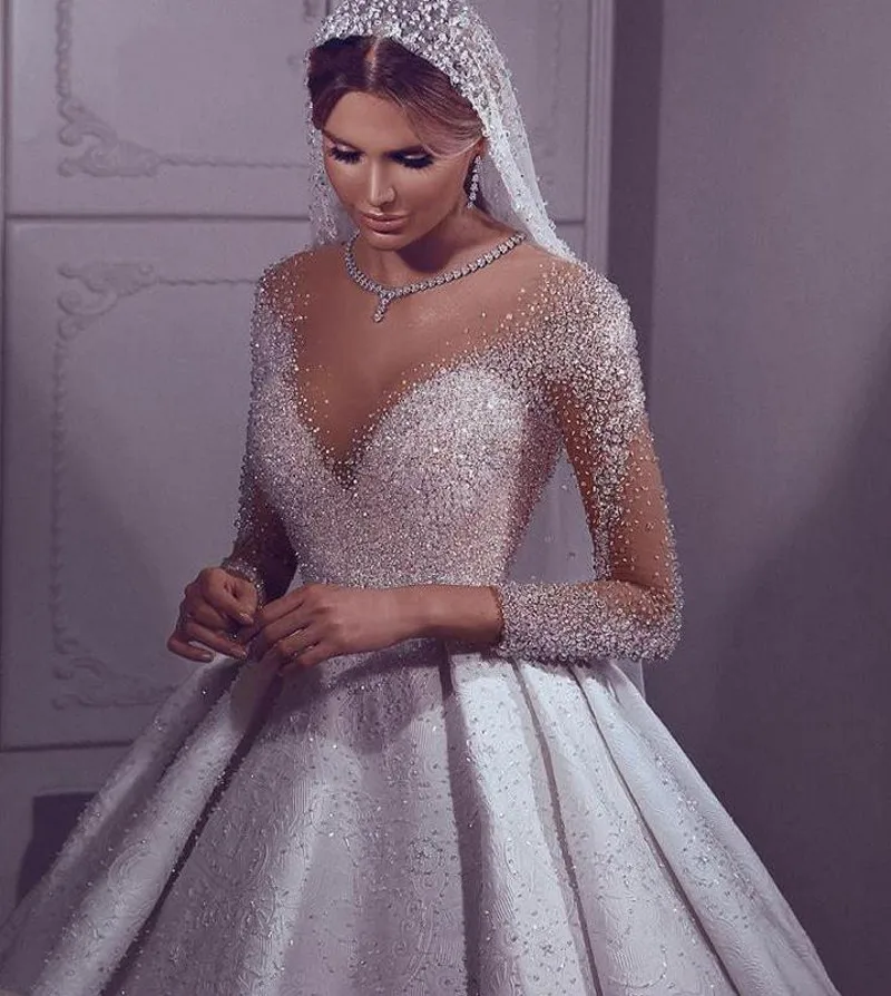 Luxury Arabic Wedding Dresses for Women 2022 Bride Illusion Neck Crystal Beaded Long Sleeves Bridal Gowns Vestidos De Noiva
Luxury Arabic Wedding Dresses for Women 2022 Bride Illusion Neck Crystal Beaded Long Sleeves Bridal Gowns Vestidos De Noiva