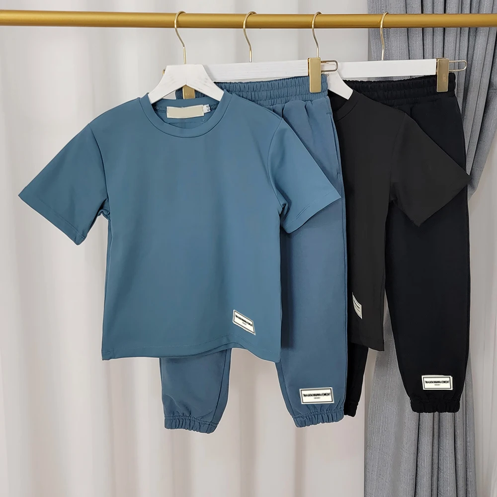 Children Loose Short Sleeved T-shirt Jogging Sweatpants Two Piece Set Kids Oversized Casual Tee Track Pants Summer Tracksuit
Children Loose Short Sleeved T-shirt Jogging Sweatpants Two Piece Set Kids Oversized Casual Tee Track Pants Summer Tracksuit