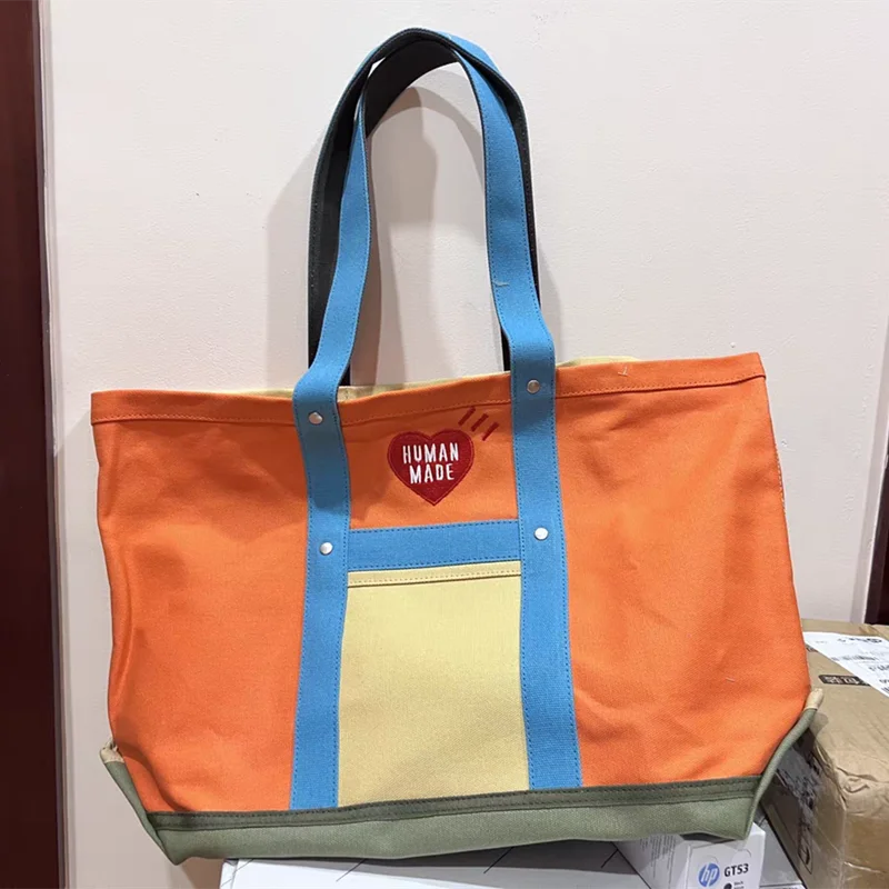 Human Made Good Quality Heart Embroidery Fashion Logo Bag Black Letter One Shoulder Human Made Messenger Bag Couple Canvas Bag
Human Made Good Quality Heart Embroidery Fashion Logo Bag Black Letter One Shoulder Human Made Messenger Bag Couple Canvas Bag