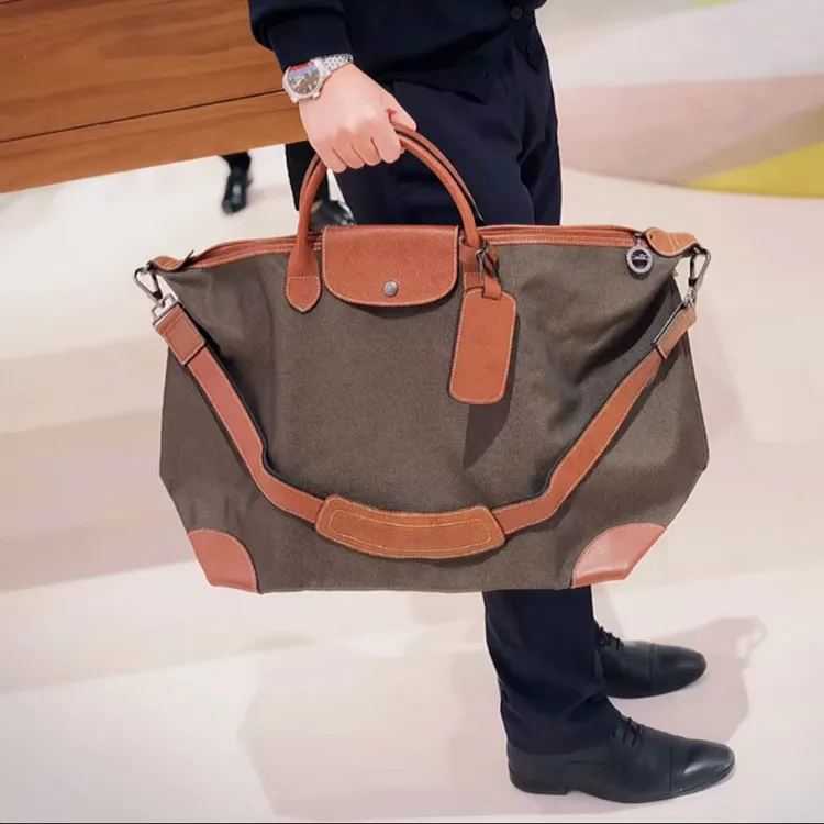 New top layer cowhide bag classic large dumpling bag unisex portable messenger travel bag
New top layer cowhide bag classic large dumpling bag unisex portable messenger travel bag