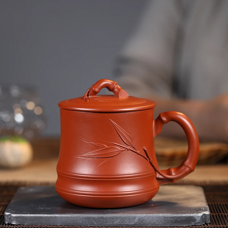 Yixing purple sand cup pure handmade large tea cup office cup household vermilion bamboo joint bamboo leaf cover cup 300ml
Yixing purple sand cup pure handmade large tea cup office cup household vermilion bamboo joint bamboo leaf cover cup 300ml
