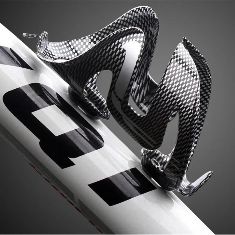 Bicycle Bottle CagePlastic Water Kettle Holder Mountain Bike Carbon Fiber Textured Double Wing Cup Cycling Bicycle Accessories
Bicycle Bottle CagePlastic Water Kettle Holder Mountain Bike Carbon Fiber Textured Double Wing Cup Cycling Bicycle Accessories