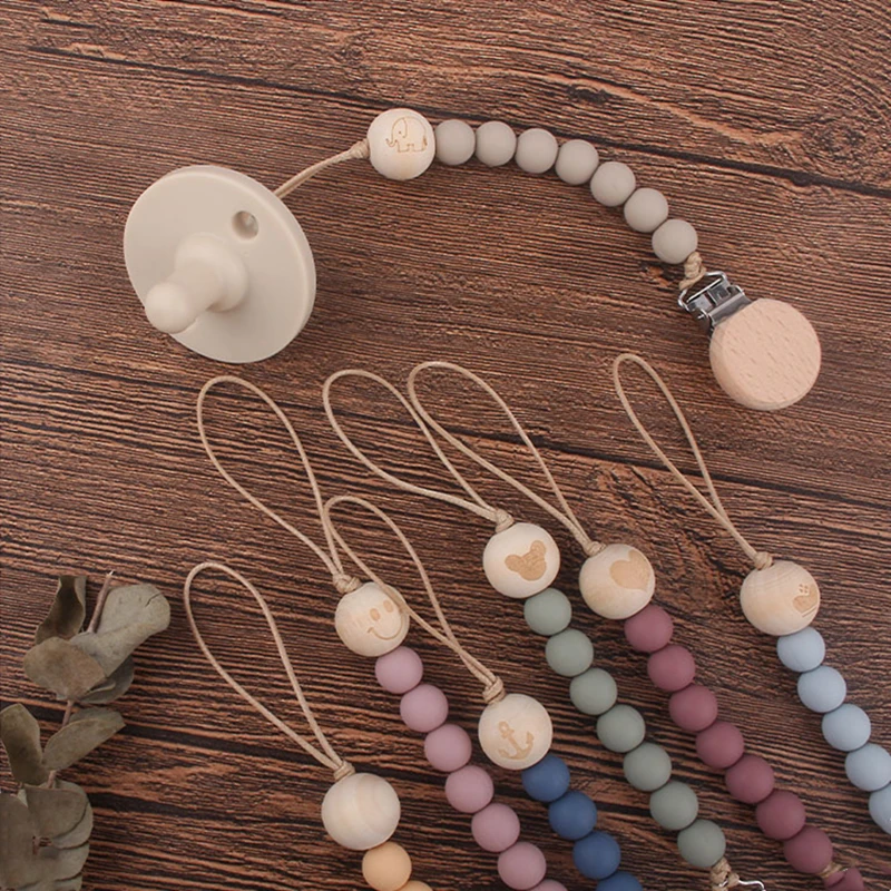 Safety Wooden Baby Infant Toddler Dummy Pacifier Silicone Soother Nipple Clip Chain Holder Strap Baby Chew Baby Teether Teething
Safety Wooden Baby Infant Toddler Dummy Pacifier Silicone Soother Nipple Clip Chain Holder Strap Baby Chew Baby Teether Teething
