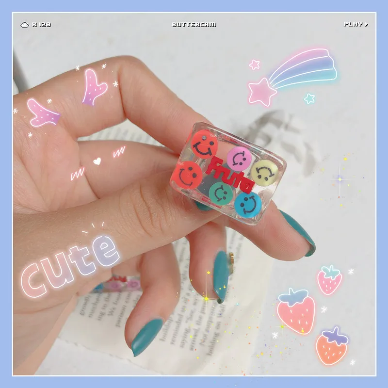 Acrylic Clear White Cartoon Letters Resin Ring with Cute Smiley Face and Crystals with Colour Block Ring
Acrylic Clear White Cartoon Letters Resin Ring with Cute Smiley Face and Crystals with Colour Block Ring