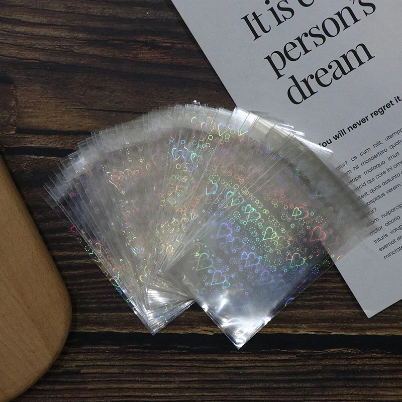 10/50Pcs Love Pattern Flat Mouth Bags Small Card Protective Cover Laser Pearlescent Storage Bags Trading Cards Shield Covers
10/50Pcs Love Pattern Flat Mouth Bags Small Card Protective Cover Laser Pearlescent Storage Bags Trading Cards Shield Covers