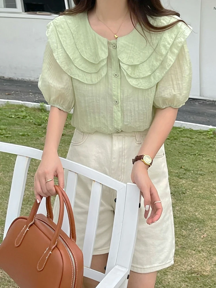 Summer New Women Shirts Sweet Ruffle Peter Pan Collar Loose Short Sleeve Blouse Woman Korean Fashion Tops 4 Colors
Summer New Women Shirts Sweet Ruffle Peter Pan Collar Loose Short Sleeve Blouse Woman Korean Fashion Tops 4 Colors