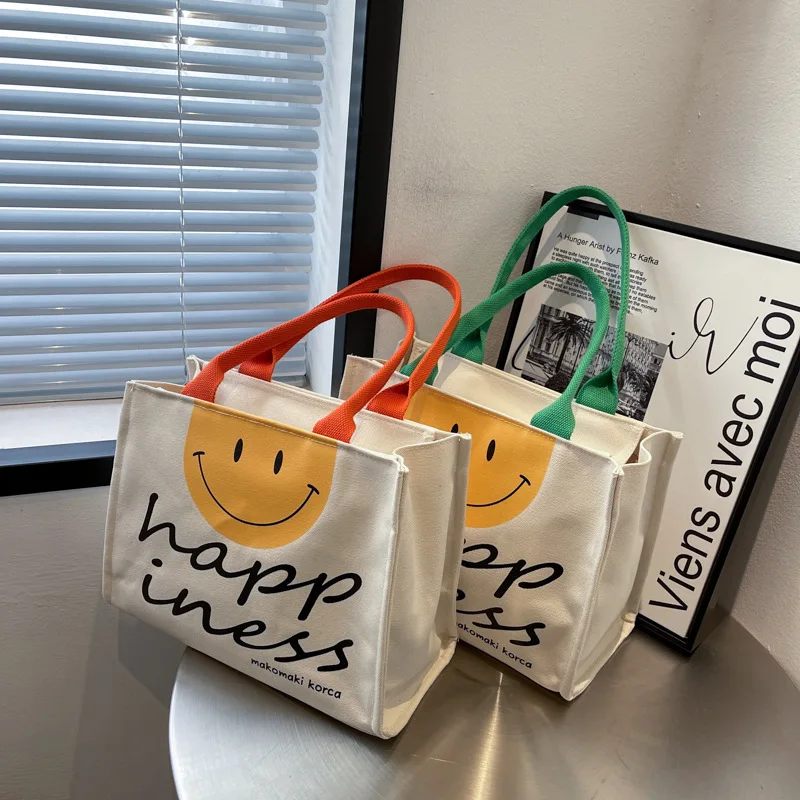 Сумка-тоут женская холщовая, повседневная вместительная дизайнерская сумочка на плечо, модный саквояж для покупок и путешествий с улыбкой
Сумка-тоут женская холщовая, повседневная вместительная дизайнерская сумочка на плечо, модный саквояж для покупок и путешествий с улыбкой