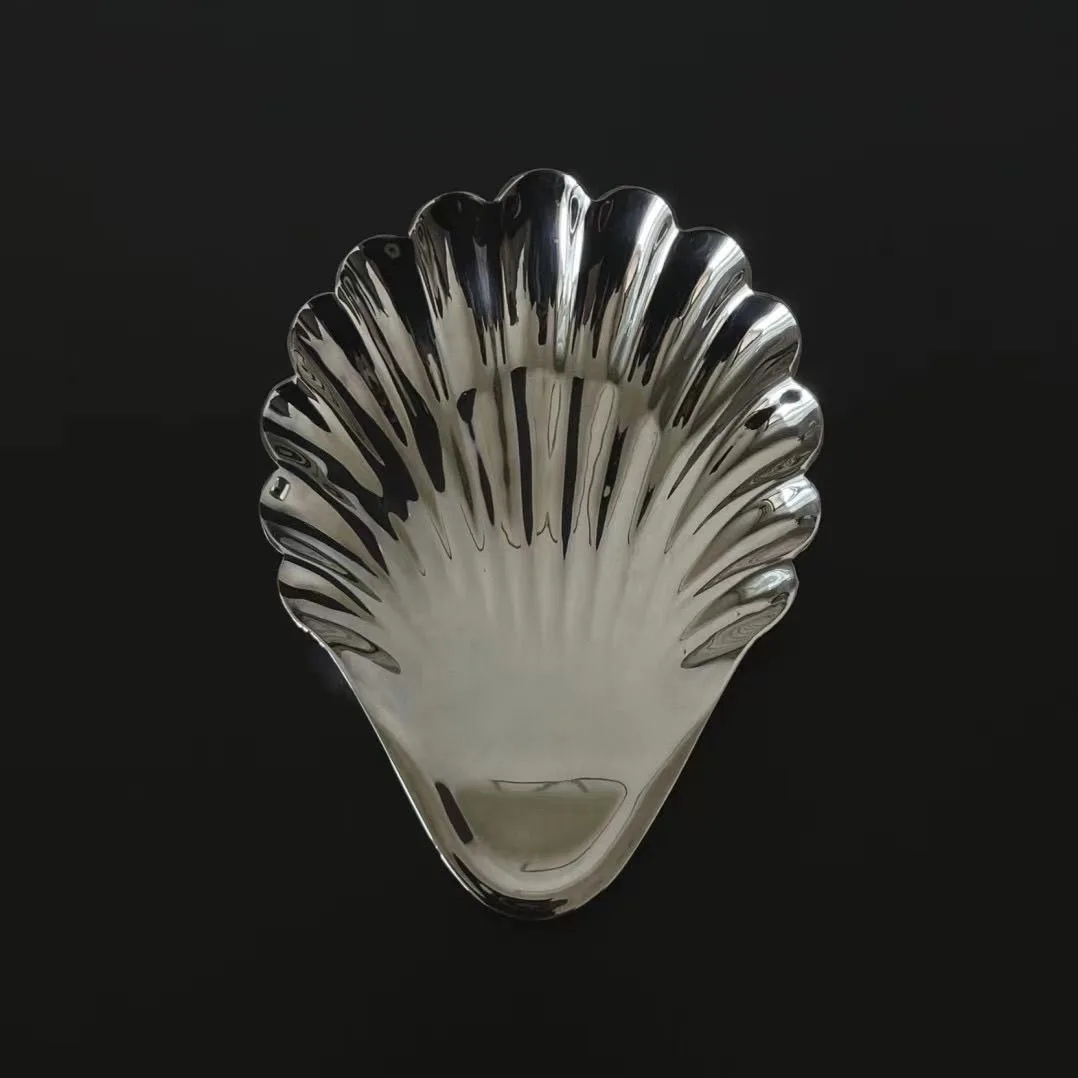 Металлическая тарелка из нержавеющей стали в форме ракушки
Металлическая тарелка из нержавеющей стали в форме ракушки