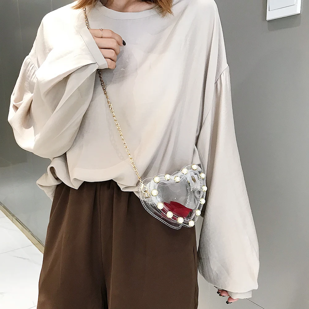 New Fashion Handbags Not Easy to Damage Small Clear PVC Crossbody Bags for Women Heart-shaped Pearl Chain Shoulder Bag
New Fashion Handbags Not Easy to Damage Small Clear PVC Crossbody Bags for Women Heart-shaped Pearl Chain Shoulder Bag