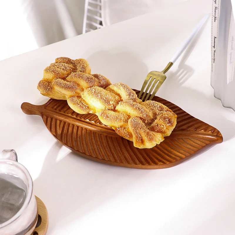 Creative leaf shape wooden plate whole wood ebony handmade dinner plate, hotel supplies, fruit plate, fruit basket
Creative leaf shape wooden plate whole wood ebony handmade dinner plate, hotel supplies, fruit plate, fruit basket
