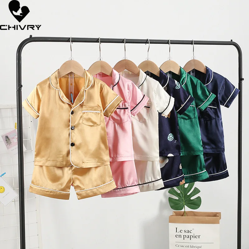 New 2022 Kids Boys Girls Silky Pajama Sets Cartoon Short Sleeve Lapel Shirt Tops with Shorts Baby Spring Summer Sleeping Clothes 
New 2022 Kids Boys Girls Silky Pajama Sets Cartoon Short Sleeve Lapel Shirt Tops with Shorts Baby Spring Summer Sleeping Clothes