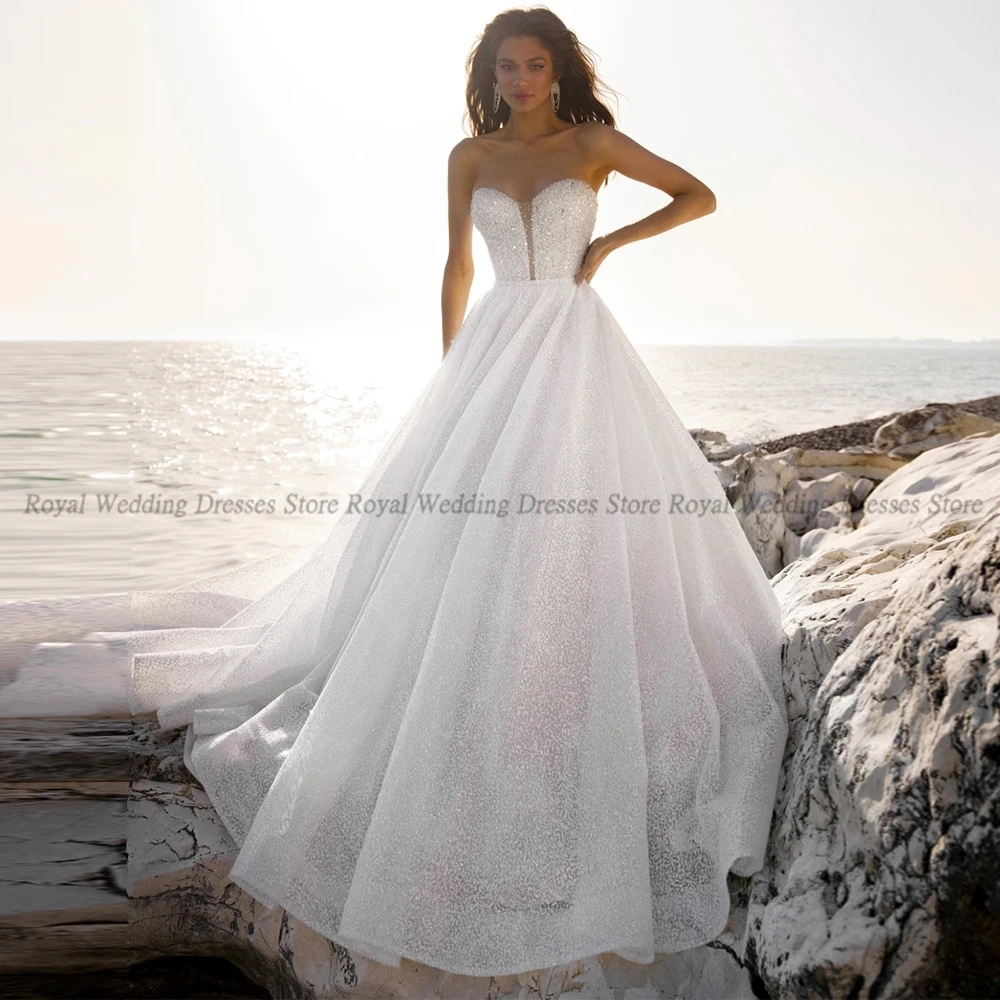 A Line Wedding Dresses Draped Strapless Paillette Sleeveless Open Back V Neck Bows 2022 Summer Floor Length Gowns Robe De Ma
A Line Wedding Dresses Draped Strapless Paillette Sleeveless Open Back V Neck Bows 2022 Summer Floor Length Gowns Robe De Ma