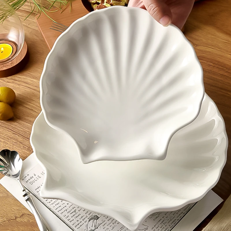 Shell shaped shallow plates, creative and personalized household plates, irregular plates, ceramic shaped tableware
Shell shaped shallow plates, creative and personalized household plates, irregular plates, ceramic shaped tableware