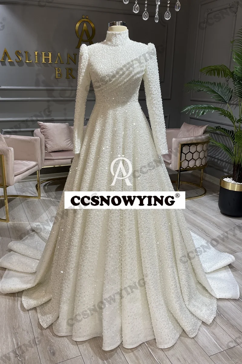 Роскошное мусульманское свадебное платье с блестками и длинным рукавом для невесты с высоким воротником исламские Свадебные платья для женщин Арабский Дубайский халат для невесты
Роскошное мусульманское свадебное платье с блестками и длинным рукавом для невесты с высоким воротником исламские Свадебные платья для женщин Арабский Дубайский халат для невесты