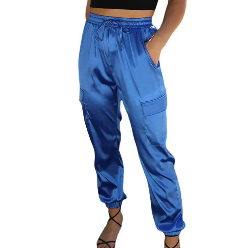 Женские повседневные атласные длинные брюки с усадочными манжетами, эластичный пояс с высокой талией, однотонные спортивные брюки со шнурком и несколькими карманами
Женские повседневные атласные длинные брюки с усадочными манжетами, эластичный пояс с высокой талией, однотонные спортивные брюки со шнурком и несколькими карманами