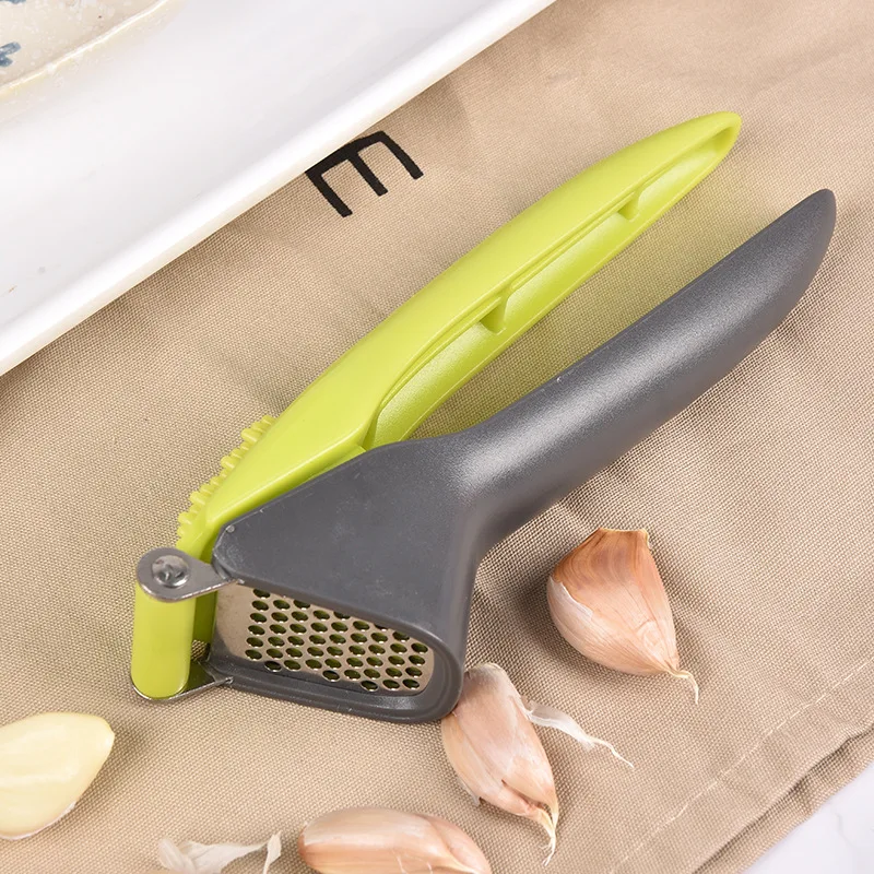 New type garlic press garlic rammer stainless steel garlic plastic handle plastic garlic rammer kitchen gadgets
New type garlic press garlic rammer stainless steel garlic plastic handle plastic garlic rammer kitchen gadgets
