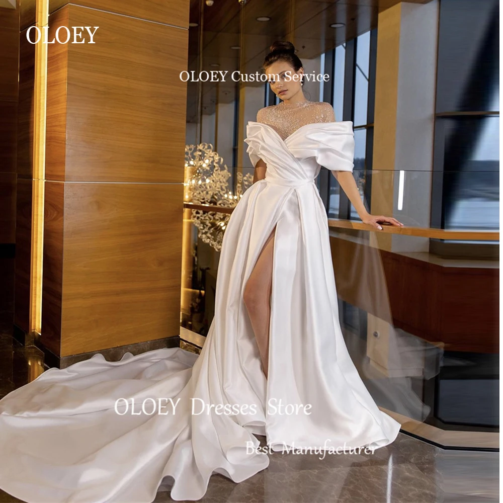 OLOEY Shiny Satin A Line Wedding Dresses Sheer High Neck Sleeves High Split Chapel Train Bridal Gowns Dubai Arabic Long Formal
OLOEY Shiny Satin A Line Wedding Dresses Sheer High Neck Sleeves High Split Chapel Train Bridal Gowns Dubai Arabic Long Formal