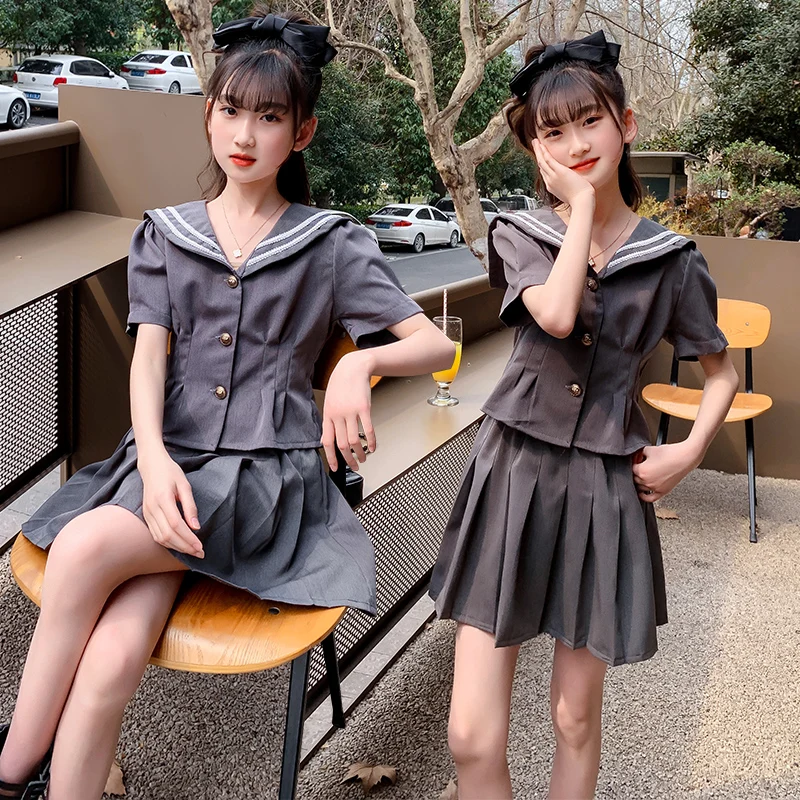 College style girls dress suit JK pleated student skirt 2022 new summer navy collar children's school uniform cheap short skirt
College style girls dress suit JK pleated student skirt 2022 new summer navy collar children's school uniform cheap short skirt