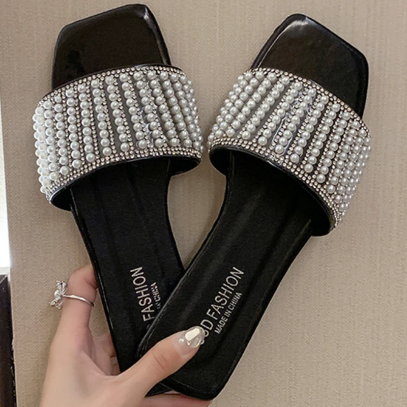 Women Slippers Summer Rhinestone White Flat Shoes Elegant Pearl External Wear 2021 Summer New Sandy Beach Sandals Women Shoes
Women Slippers Summer Rhinestone White Flat Shoes Elegant Pearl External Wear 2021 Summer New Sandy Beach Sandals Women Shoes