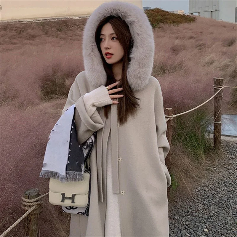Women Winter Elegant Solid Big Fur Coat Collar Woolen Coats Cloak Cape Female Red Thick Warm Long Coats Korean Hooded Outerwears
Women Winter Elegant Solid Big Fur Coat Collar Woolen Coats Cloak Cape Female Red Thick Warm Long Coats Korean Hooded Outerwears