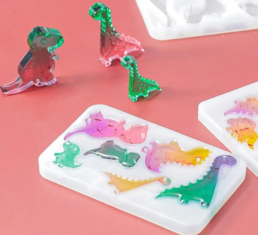 DIY Dinosaur Pendant Crystal Epoxy Resin Mold Double Hole Flying Dragon Sword Dragon Wind Chime Silicone Mold 
DIY Dinosaur Pendant Crystal Epoxy Resin Mold Double Hole Flying Dragon Sword Dragon Wind Chime Silicone Mold