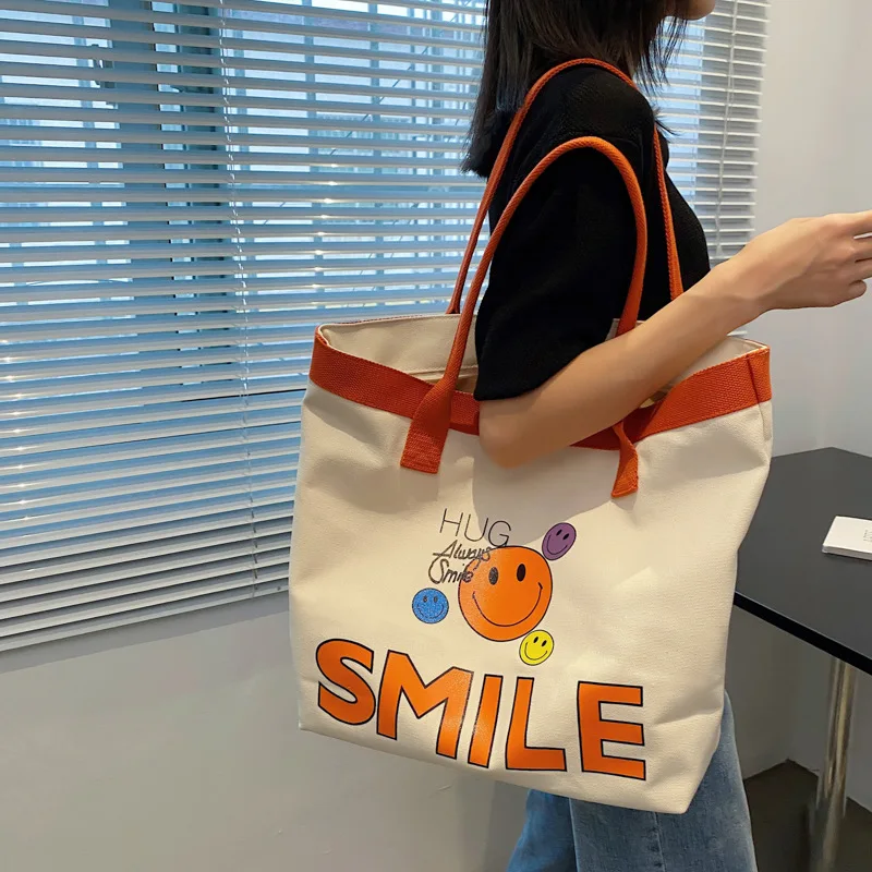 Fashion Printed Letters Smiley Face Canvas Bag INS Tide Brand Women's Canvas One Shoulder Large Bag Portable Tote Bag Handbag
Fashion Printed Letters Smiley Face Canvas Bag INS Tide Brand Women's Canvas One Shoulder Large Bag Portable Tote Bag Handbag