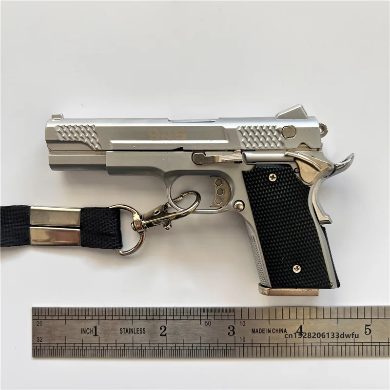 1:2.05 Colt 945 игрушечный пистолет, миниатюрная модель, металлический корпус, аксессуары для выброса, пули, брелок, ожерелье для детей и взрослых, подарки 
1:2.05 Colt 945 игрушечный пистолет, миниатюрная модель, металлический корпус, аксессуары для выброса, пули, брелок, ожерелье для детей и взрослых, подарки